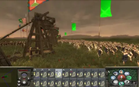 Bitwa w grze strategicznej, przypominającej gry podobne do Total War. Ogromna armia w starożytnych strojach, machiny oblężnicze i flagi na tle pochmurnego nieba.
