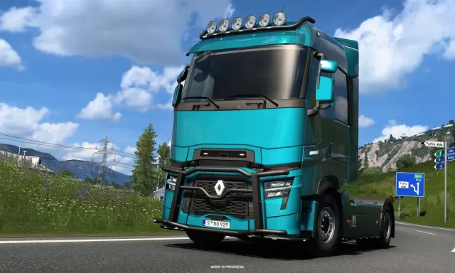 Turkusowa ciężarówka w Euro Truck Simulator 2 PS5 na górskiej drodze.