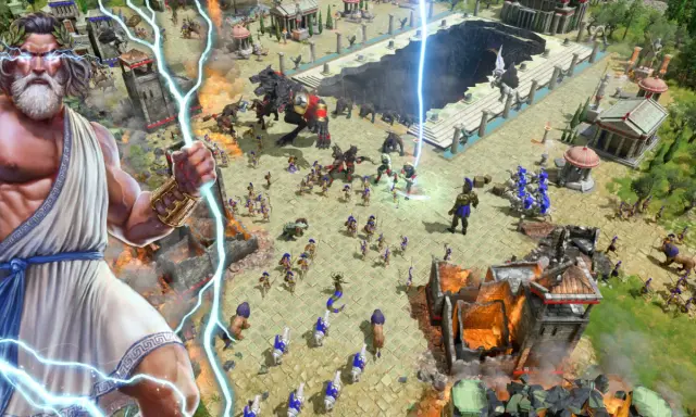 Zeus ciska piorunami na polu bitwy w grze strategicznej. Armie walczą, a potwory sieją zniszczenie.