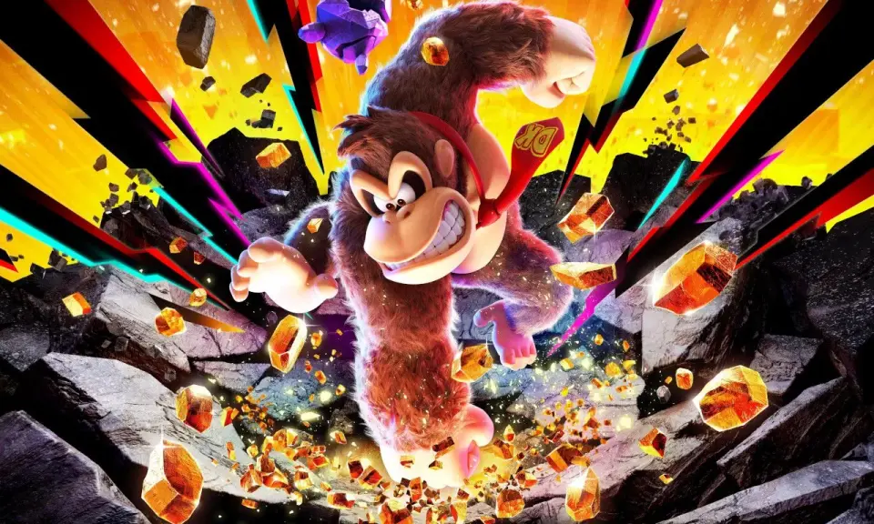 Donkey Kong w akcji, otoczony przez spadające skały i błyszczące kryształy, z kolorowymi promieniami w tle.