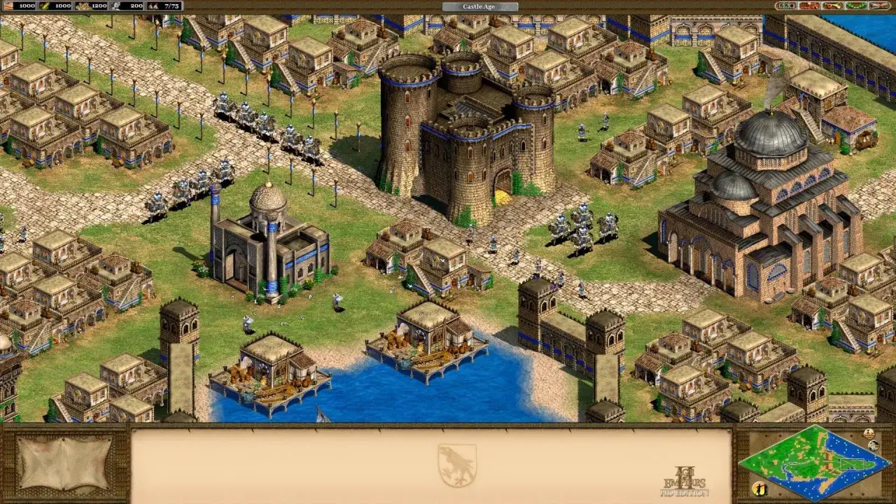 Zamek i meczet w grze RTS. Jednostki rycerzy maszerują po brukowanych drogach, budynki mieszkalne i port na wodzie.