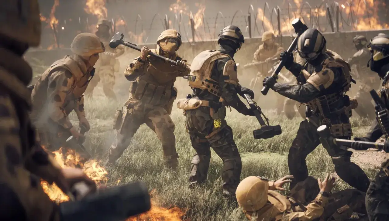 Żołnierze z młotami na tle płomieni, gotowi do walki. To scena z gry Battlefield 6, dostępnej w Game Pass.